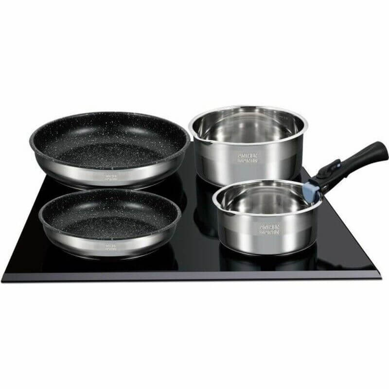 Ensemble de casseroles et poêles en acier inoxydable avec revêtement noir sur une plaque de cuisson vitrocéramique.